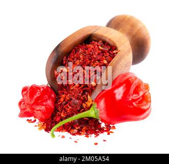 Fresh and dry ground red chili peppers isolated on white background. Capsicum baccatum or Bishop's crown pepper. Stock Photo