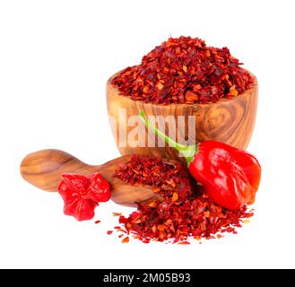 Fresh and dry ground red chili peppers isolated on white background. Capsicum baccatum or Bishop's crown pepper. Stock Photo