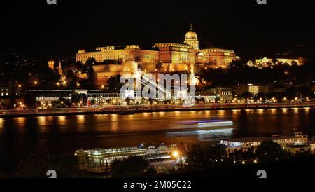 Night shot, long exposure photography, famous historical Buda Castle in illuminated at night, Royal Palace view by the Danube river, Budapest, Hungary Stock Photo