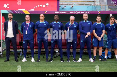 England staff including manager Gareth Southgate, assistants Steve Holland, Paul Nevin and Chris Powell, goalkeeping coach Martyn Margetson, physio Simon Spencer and head physio Steve Kemp before the FIFA World Cup Group B match at the Khalifa International Stadium in Doha, Qatar. Picture date: Monday November 21, 2022. Stock Photo