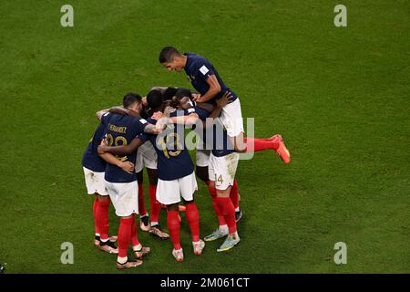 Doha, Qatar. 4th Dec, 2022. Players of France celebrate their goal during the Round of 16 match between France and Poland of the 2022 FIFA World Cup at Al Thumama Stadium in Doha, Qatar, Dec. 4, 2022. Credit: Xia Yifang/Xinhua/Alamy Live News Stock Photo