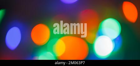 Bokeh blur background from a blurred light. Christmas and New Year holidays background. Defocused Stock Photo