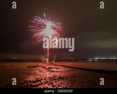 Queenborough, Kent, UK. 4th Dec, 2022. Queenborough in Kent's annual Christmas light / torch parade through the high street ending with a firework display in the harbour. Credit: James Bell/Alamy Live News Stock Photo