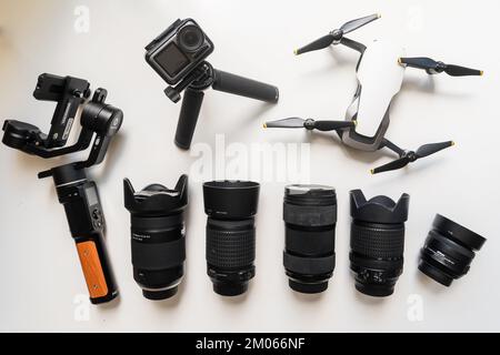 Professional video and photo equipment including action camera, hard drive drone and hard drives, power bank cut out on white isolated background Stock Photo