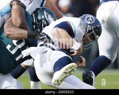 Philadelphia, United States. 04th Dec, 2022. Tennessee Titans quarterback Ryan Tannehill is sacked in the first quarter by Philadelphia Eagles Javon Hargrave in week 13 of the NFL season at Lincoln Financial Field in Philadelphia on Sunday, December 4, 2022. Photo by John Angelillo/UPI Credit: UPI/Alamy Live News Stock Photo