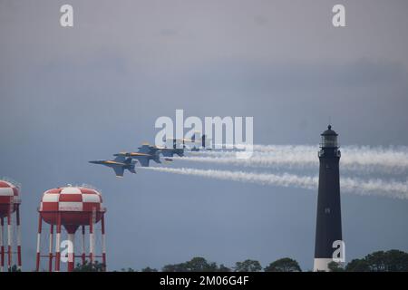 US Navy Blue Angels flying by the Pensacola Lighthouse during an airshow at NAS Pensacola Stock Photo