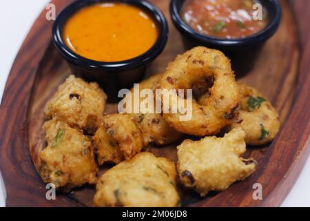 traditional indian snack food, crispy deep fried vada and chutneys in a serving plate Stock Photo