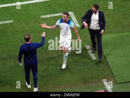 England's Jordan Henderson with England assisant coach Steve Holland and manager Gareth Southgate after being substituted during the FIFA World Cup Round of Sixteen match at the Al-Bayt Stadium in Al Khor, Qatar. Picture date: Sunday December 4, 2022. Stock Photo