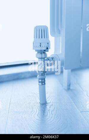 thermostat valve on white radiator close up Stock Photo