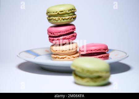 colourful stacked Macarons on plate Stock Photo