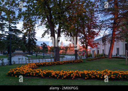 View of city of Segovia behind the Orange Flowers in the Garden of the Alcazar Castle Stock Photo