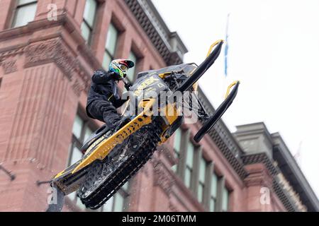 World snowmobiling champions perform aerial tricks in downtown Montreal. Quebec,Canada Stock Photo