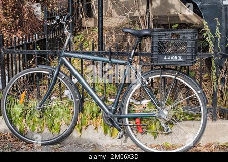 Bicycle with basket parked in Montreal, Quebec, Canada Stock Photo