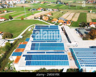 Energy efficient industrial warehouse with solar panels on the roof Stock Photo