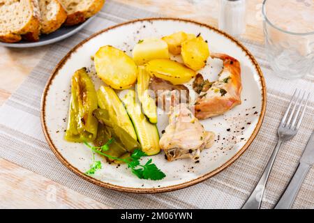 Roasted rabbit served with vegetable garnish Stock Photo