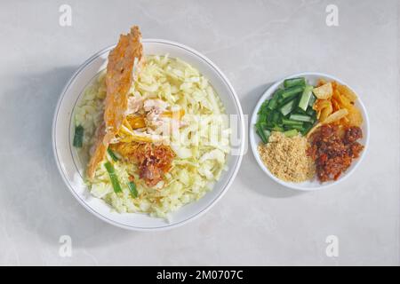 Soto Ayam (yellow chicken soup) is a popular traditional dish in Indonesia Stock Photo