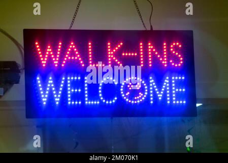 business neon  sign walk ins welcome Stock Photo