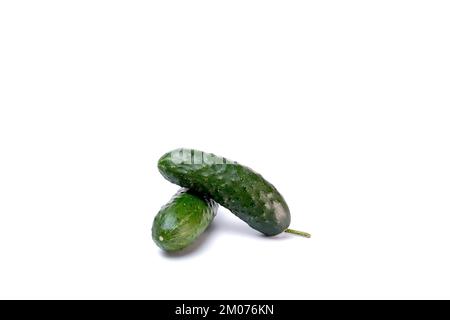 Ripe fresh green cucumbers isolated on a white background. Stock Photo