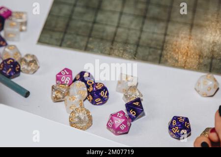 Polyhedral bone on the playing surface. This type of dice is used for role-playing games Stock Photo