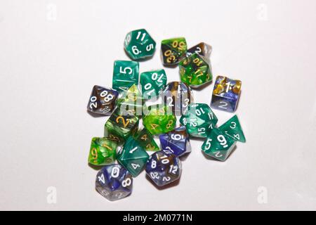 dices for board games, dnd and rpg scattered on light surface Stock Photo