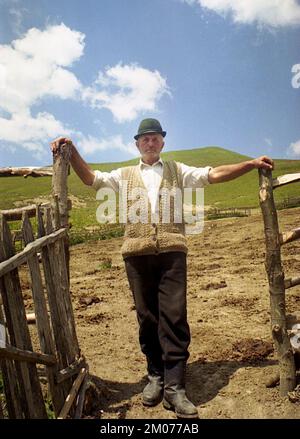 Prahova County, Romania, May 1990. Shepherd standing in the door of the sheep pen. Stock Photo