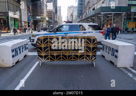 New York, United States. 04th Dec, 2022. NEW YORK, NEW YORK - DECEMBER 04: NYPD Car blocks entrance to cars on Fifth Avenue on December 04, 2022 in New York City. Sunday Fifth Avenue closed off for several hours part of the official kick-off of 'Fifth Avenue for All', a new program that will transform 5th Avenue from 47th-57th Streets, into a pedestrian-only experience every Sunday in December, marking the city's largest-ever holiday season-specific open street. Credit: Ron Adar/Alamy Live News Stock Photo