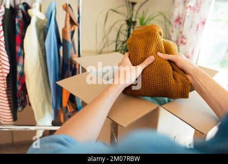 Pre owned clothes resale or donation. Stock Photo