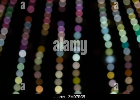 Golden abstract yellow, orange bokeh lights isolated on black background with copy space. Holiday and Christmas season concept, graphic resources, gre Stock Photo