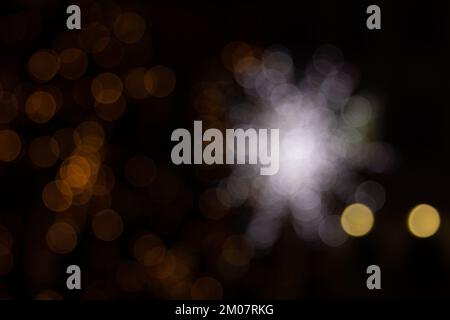 Golden abstract yellow, orange bokeh lights isolated on black background with copy space. Holiday and Christmas season concept, graphic resources, gre Stock Photo