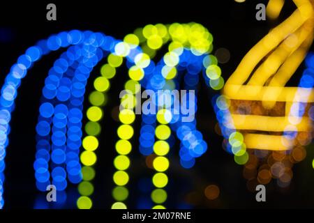 Golden abstract yellow, orange bokeh lights isolated on black background with copy space. Holiday and Christmas season concept, graphic resources, gre Stock Photo