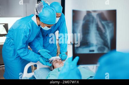 Patient, surgeon and team in operating room, hospital and healthcare emergency, surgery or medical clinic. Doctors, nursing staff or workers in face Stock Photo