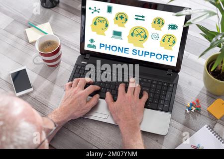 Phone support concept shown on a laptop used by a man Stock Photo
