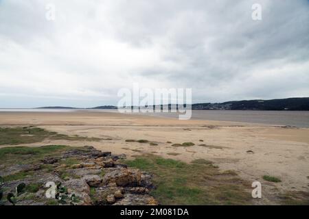 View across Morecambe Bay and the River Kent Estuary at low tide towards Grange Over Sands from Blackstone Point, Arnside, Cumbria, England, United Ki Stock Photo