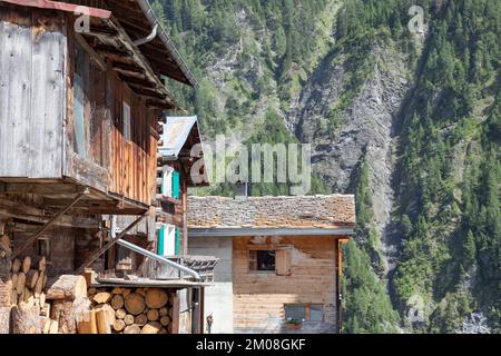 wooden house with a supply of firewood in vrin, switzerland Stock Photo