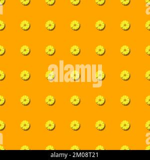 Seamless pattern with arranged yellow daisy flowers on orange background Stock Photo