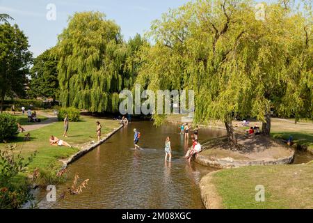 People enjoying summer weather in Queen Elizabeth Gardens Salisbury Stock Photo