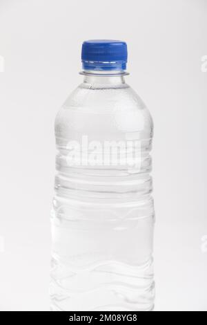 A full plastic bottle of water on a white background Stock Photo