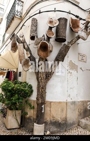 Alcacer do Sal, Setubal, Portugal- October 28, 2022: Decorative tree made of cork on the street in Portugal Stock Photo