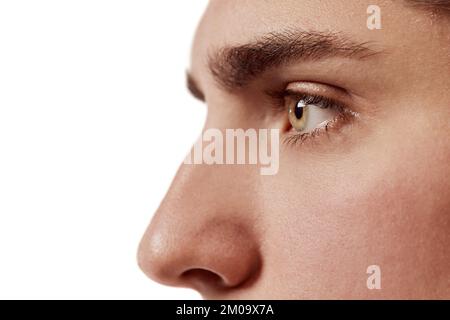 Side view portrait of young man isolated over white background. Nose, eyes. Plastic surgery. Concept of male beauty, body and skincare Stock Photo