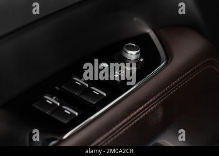 Side mirrors control panel on side door. Stock Photo