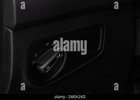Closeup of the headlight switch control button. Lights control panel in car Stock Photo