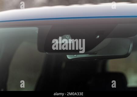 Windshield rain and light sensors of modern car. Car rain sensor. Stock Photo