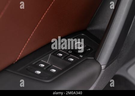 Side mirrors control panel on side door. Stock Photo