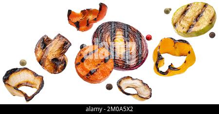 Falling grilled vegetable slices isolated on white background Stock Photo