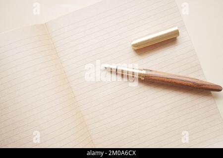 old empty paper and fountain pen on table  Stock Photo