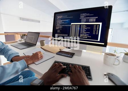 Team of developers working on new software, first person view Stock Photo