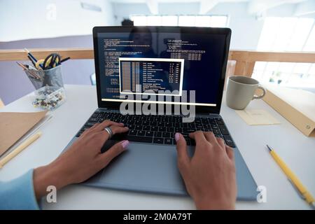Hands of programmer testing code of new software on laptop Stock Photo