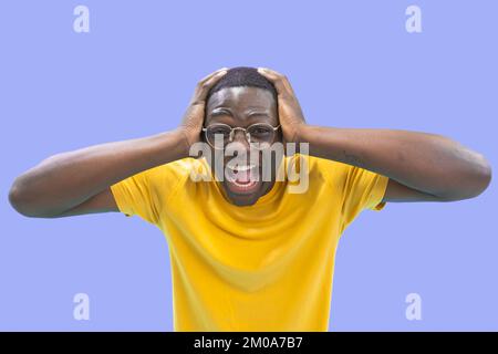 Handsome African American man with hands in head excited and scared with open mouth. Stock Photo