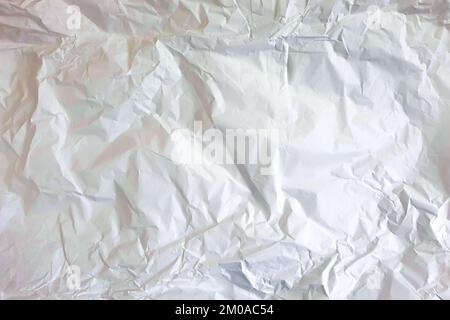 Crumpled white wrapping paper texture background. Top view Stock Photo
