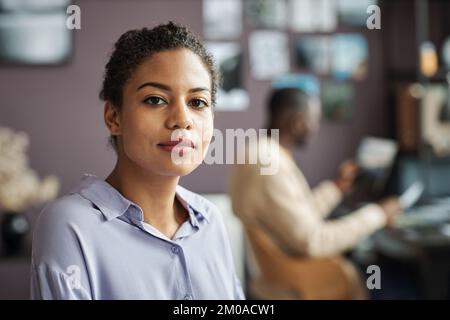 Portrait of young female graphic designer working in office Stock Photo
